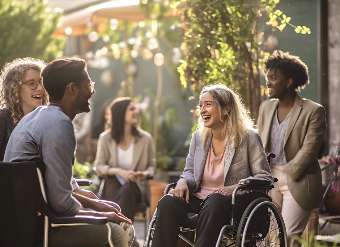 Insurance Solutions - Happy People in Wheelchairs at the Park